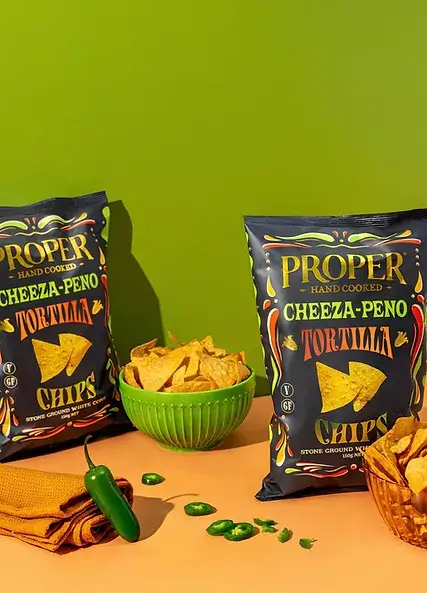 cheeza-peño tortilla chips lifestyle image jalapeño jalapeno tortilla chips in a green bowl