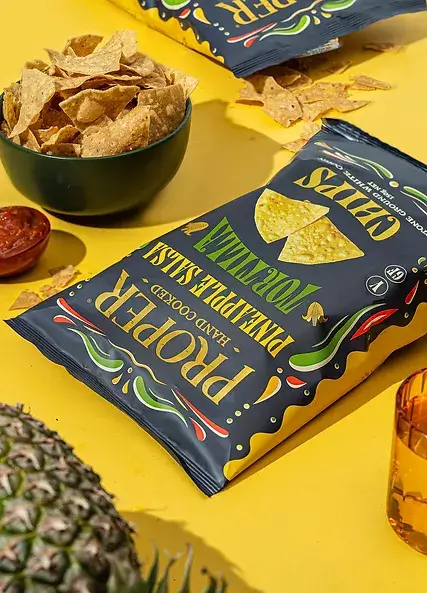 pineapple salsa tortilla chips lifestyle image chips in a green bowl