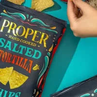 salted tortilla chips lfiestyle image on cyan background