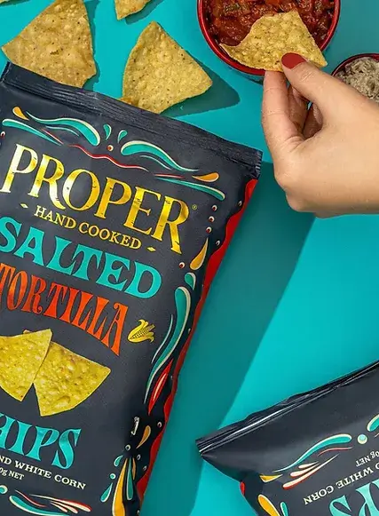 salted tortilla chips lfiestyle image on cyan background